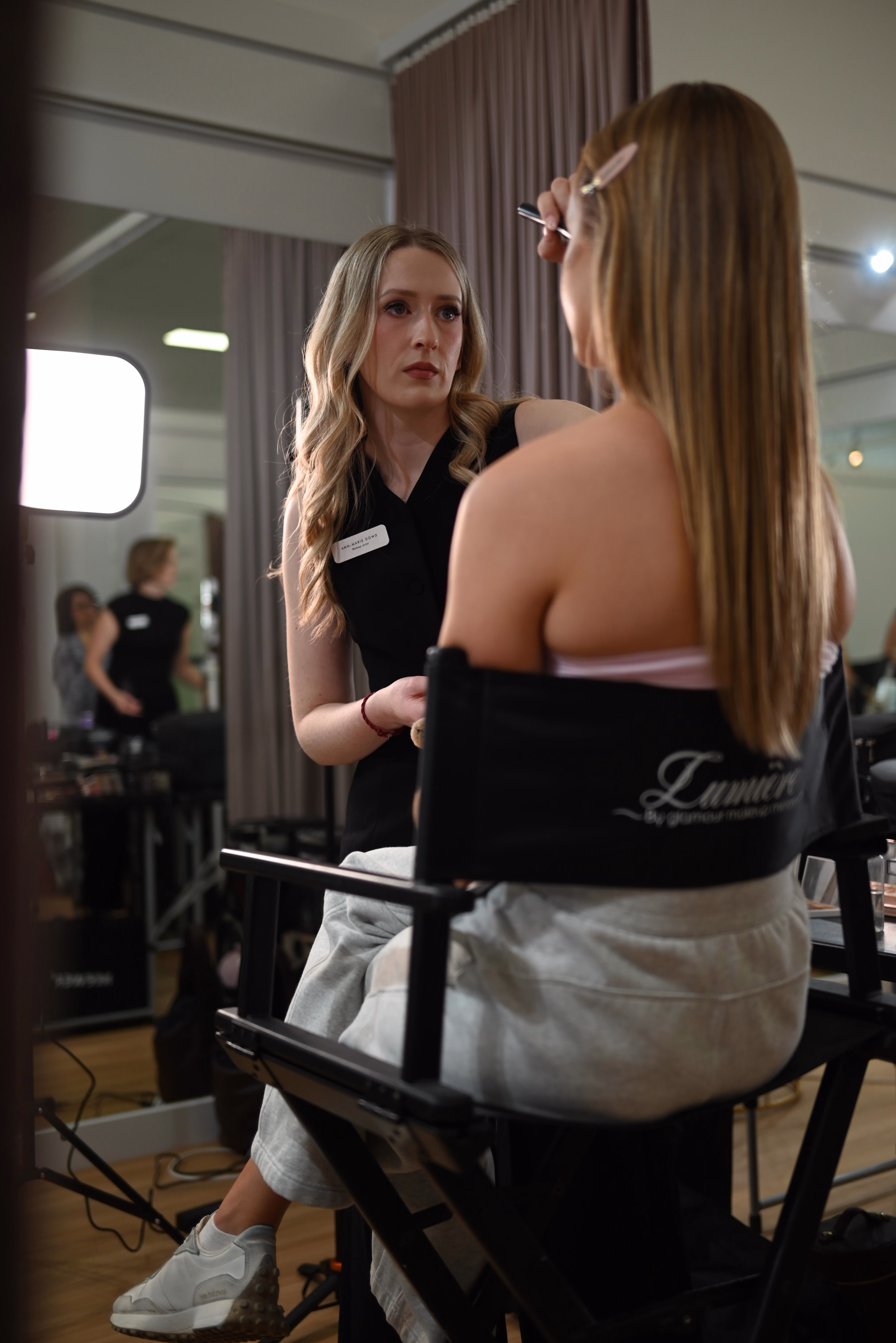 Ann-Marie at her chair working on a client