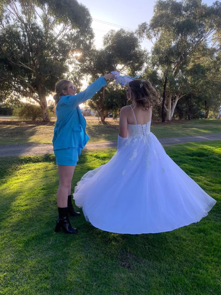 A debutante in a white gown before her ball